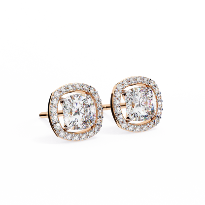 Front view of cushion cut diamond halo stud earrings in 14K rose gold with brilliant center stones.