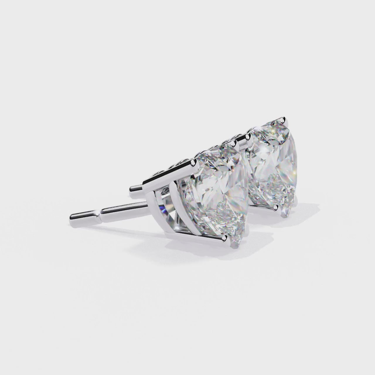 Side profile of heart-shaped diamond stud earring in white gold - kalptarugems.com